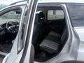 A 2014 Ford Escape with a view of the open rear door showing the interior seating and black and gray upholstery