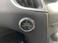 Close-up of the engine start/stop button in a 2017 Ford Edge with a green light indicating readiness to start the engine