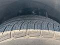 Close-up view of a tire from a 2017 Chevrolet Colorado showcasing the tread pattern and rubber detail