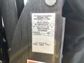 A label on a device with details about the Braun Corporation's product specifications including model number lifting capacity and manufacturing date