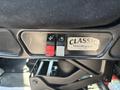Controls for adjustable seating and a label for Classic Trucking Company on the side of a 2008 Peterbilt 340 truck seat