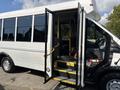 A white 2018 Ford Transit-350 with an open door revealing steps leading inside the vehicle