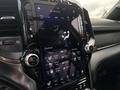 Close-up of the touchscreen display in a 2021 RAM 1500 showing controls for climate settings seat ventilation and heating options