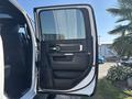 A 2018 RAM 3500 truck door is open showing a black interior with a sleek design and modern controls