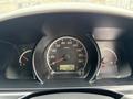 Dashboard of a 2009 Toyota Hiace showing speedometer fuel gauge and warning lights