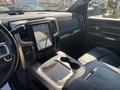 A 2018 RAM 3500 interior featuring a large touchscreen display in the center console stylish black leather seating and various controls on the dashboard
