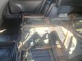 The image shows the interior of a 2020 Ford Explorer with the rear seat removed revealing the floor structure and metal framing underneath