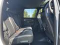 Interior of a 2018 RAM 3500 showing black leather rear seats with ample legroom and a sleek design