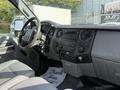 Interior view of a 2011 Ford F-250 SD showcasing the dashboard with controls a radio and a steering wheel