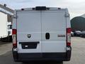 White 2017 RAM Promaster van with a rear view showing the brand logo and license plate area