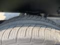 A close-up of a tire on a 2017 Chevrolet Colorado showcasing the tread pattern and rubber surface