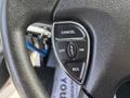 Close-up of a steering wheel control panel with buttons labeled CANCEL OFF ON SET and RES on a textured black surface