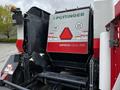 A 2020 Pottinger Impress 155 VC Pro baler featuring a large rectangular hopper with branding and product information displayed on the side in red and white colors