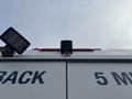 A 2021 Ford Transit-350 with a visible rear camera and a light mounted on the top of the vehicle