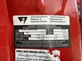 A red 2007 Ford F-550 with a Canada certification label indicating inspection details and vehicle specifications