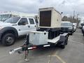 A 2005 Katolight SED60FPJ4 generator mounted on a trailer with a silver storage box in front of it