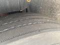 Close-up of a worn tire with visible tread patterns used on a 1997 Freightliner FL70