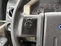 Close-up of the steering wheel of a 2008 Ford F-350 showing the cruise control buttons labeled Set and Res along with On and Off controls