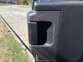 Close-up of a black door handle on a 2016 Ford Transit 150 van showing its design and texture