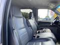 Interior of a 2007 Ford F-350 SD with two grey leather front seats and visible seat belts