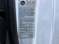 A 2007 Ford Econoline vehicle identification label displaying weight limits and specifications for front, intermediate, and rear axles