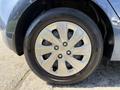 A close-up of a 2018 Kia Rio5 wheel showing a metallic silver alloy rim with five spokes and a black tire with tread pattern