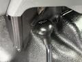A close-up of the gear shift knob from a 2016 Ford F-550 Super Duty showing the design and markings for transmission settings