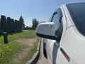 Side view of a white 2017 Chevrolet Colorado showcasing the mirror and side detail