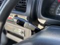Close-up of the windshield wiper control lever in a 2008 Suzuki Carry with settings for mist off intermittent and low