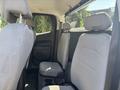 Interior view of a 2017 Chevrolet Colorado showing the back seat area with two gray fabric seats and headrests
