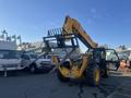 A 2013 JCB 510-56 Loadall with a yellow body and black attachments including forks for lifting and moving heavy materials
