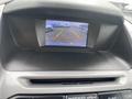 Display screen showing a rearview camera view with guiding lines in a 2017 Ford Transit Connect