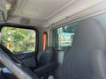 Interior view of a 2015 Peterbilt 337 showing the driver's seat steering wheel and dashboard area with a focus on the driver's seat