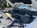 2021 Ford F-150 engine bay showing the engine components battery and reservoir tank