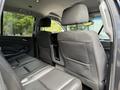 Interior view of the back seats of a 2017 Chevrolet Tahoe featuring dark fabric upholstery and headrests
