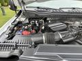 Close-up view of the engine compartment of a 2020 Ford F-550 showing the air intake and battery components