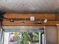 Interior view of a 2008 Workhorse W62 showing an overhead wooden panel with electrical outlets and wiring attachments