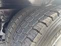 Close-up of a tire on a 2013 International WorkStar showing deep treads and details of the rubber surface designed for traction and stability