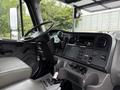 Interior view of a 2021 Freightliner M2 106 truck showing the driver's seat dashboard controls and instrument panel