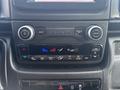 The dashboard controls of a 2022 RAM Promaster 350 featuring buttons for volume air conditioning and screen settings