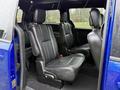 Interior of a 2020 Dodge Grand Caravan showing black leather seats arranged in a spacious layout with two rows of seating visible