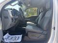 Interior of a 2023 Ford F-350 SD showing front seats with gray upholstery and a dashboard with gauges and controls