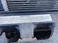 A close-up of a metal component featuring a modifications label on a 2016 Ford F-250 SD engine