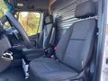 Interior of a 2021 Mercedes-Benz Sprinter 2500 showing two black fabric seats and a steering wheel with a focus on the driver's area