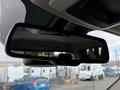 Rearview mirror of a 2018 RAM 1500 showing a reflection of the truck's interior