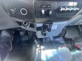 Interior console of a 2016 Ford F-350 SD featuring controls and switches along with a gear shift and an ashtray