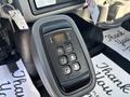 Close-up of a gear shift panel from a 2013 International 7500 featuring buttons for gear selection including neutral reverse and a mode indicator