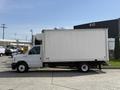 A white 2023 Ford E-450 box truck with a large enclosed cargo area and a low-profile chassis