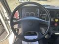 Steering wheel and dashboard of a 2022 Freightliner M2 106 displaying various gauges and controls
