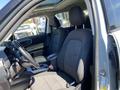 Interior of a 2023 Ford Bronco Sport featuring two front seats with fabric upholstery a steering wheel and a gear shift in the center console